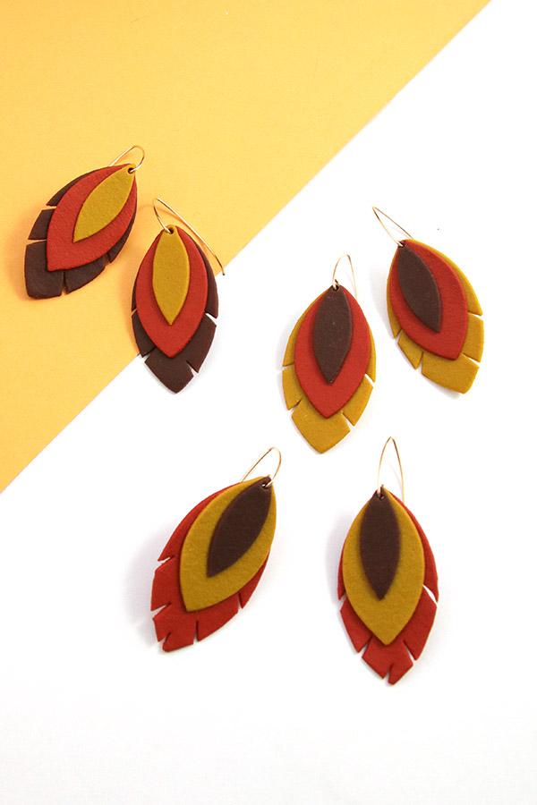 Schema  Leather-effect Fimo feather earrings