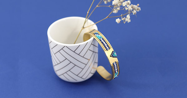 Blue and gold Miyuki delicas woven beaded ring