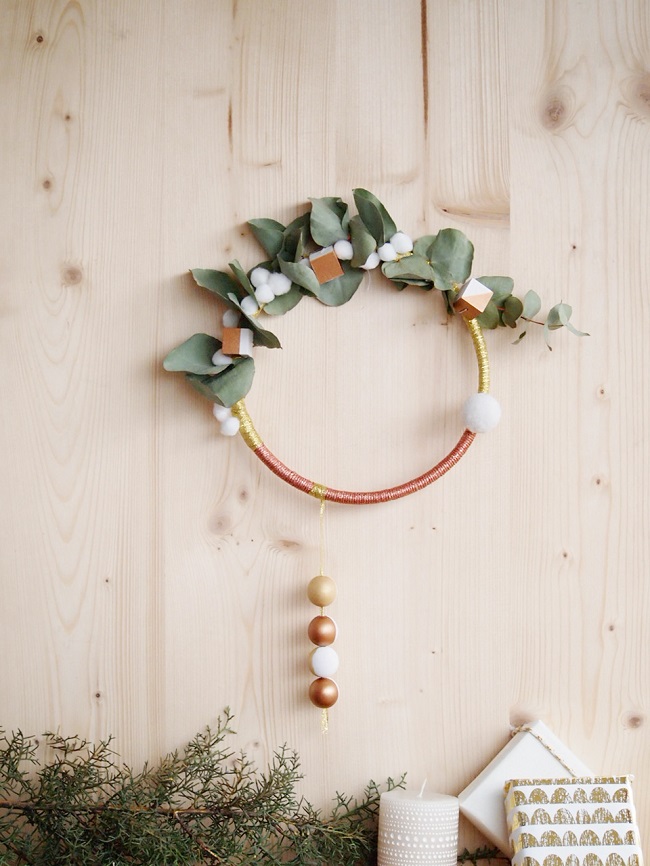 Schema Bohemian gold and copper christmas wreath with eucalyptus branch and tassels Schema Bohemian gold and copper christmas wreath with eucalyptus branch and tassels