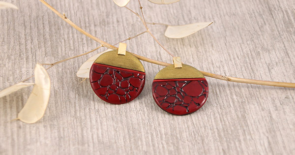 Red curls made of imitation croco polymer clay Red curls made of imitation croco polymer clay