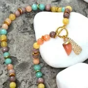 Mini tooth pendant with a synthetic faceted gemstone 20 mm Red Aventurine/Gold x1