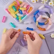 Set of 60 transparent acrylic beads, curved tube 35x11mm, crackle effect
