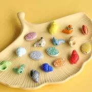 19x14mm Flat oval ceramic bead - Aztec pattern - White - Yellow x1