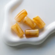 Curved tube beads 29x14 mm in translucent acrylic - Marbled Amber - White x10