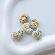 Ceramic shell bead snail 21x16 mm - Blue - Gold x1