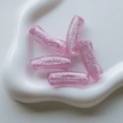 Curved tube beads 35x11 mm in transparent acrylic - Pink Glitter Silver x6