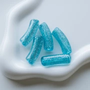 Curved tube beads 35x11 mm in transparent acrylic - Blue Glitter Silver x6