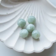 14 mm irregular faceted round bead, translucent resin - Marbled sage green