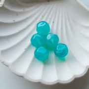 14 mm irregular faceted round bead, translucent resin - Caribbean Blue x1