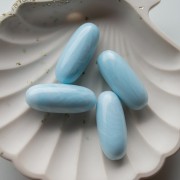 34x14 mm olive-colored opaque resin bead - Marbled baby blue x1