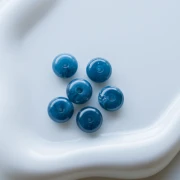 Rondelle beads 12x7 mm in opaque resin - Marbled petrol blue x6