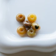Rondelle beads 12x7 mm in translucent resin - Light marbled amber x6