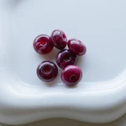 Rondelle beads 12x7 mm in opaque resin - Marbled garnet x6