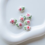 Ceramic oval bead 15.5x12.5 mm - Flower motif - White - Pink - Green x1