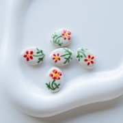 Ceramic oval bead 19.5x14.5 mm - Flower motif - White - Red - Green x1