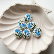 19x16 mm oval ceramic bead - flower motif - White - Blue - Green x1