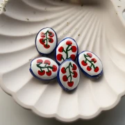 Ceramic oval bead 22x16.5 mm - Tomato pattern - White - Red - Blue x1