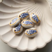 21x16 mm oval ceramic bead - fish motif - White - Ochre - Blue x1