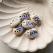 21x16 mm oval ceramic bead - fish motif - White - Ochre - Blue x1