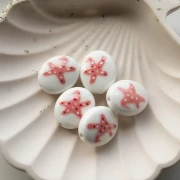 Ceramic oval bead 21x18 mm - Starfish motif - White - Pink x1