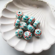 Ceramic roundel bead 15x10.5 mm - Turquoise - Red x1