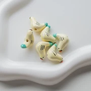 Ceramic bird bead 15x21 mm - Beige - Turquoise x1