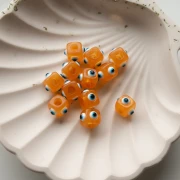 Resin cube bead 8 mm - raised eye motif - Orange - White - Blue x1