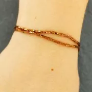 Mini-beads imitation hematite cubes 1.4mm Light Copper x40cm