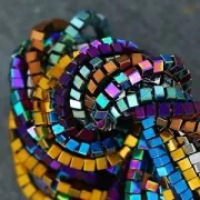 Mini-beads imitation hematite cubes 1.4mm Dark Purple Metallic x40cm