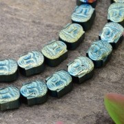 8.5x7x4mm Synthetic Hematite bead Head of Buddha - Light Green Metallic x1