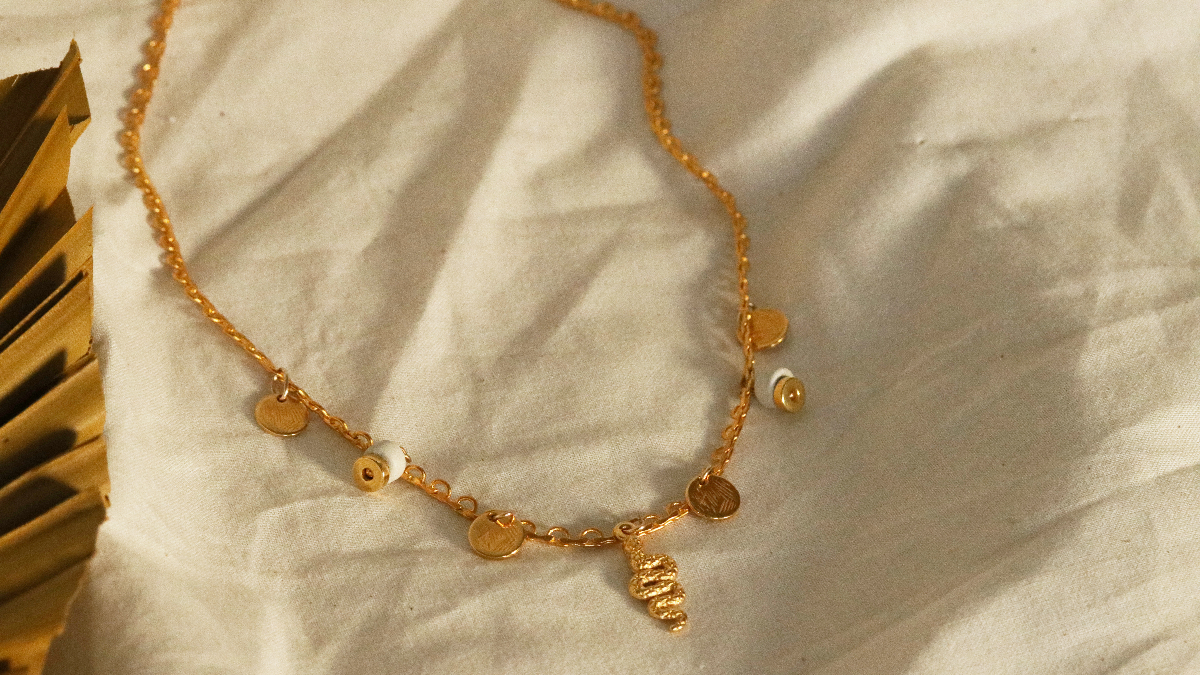 Gold plated Charlotte necklace with fine gold snake charms, sequins and ceramic heishi beads