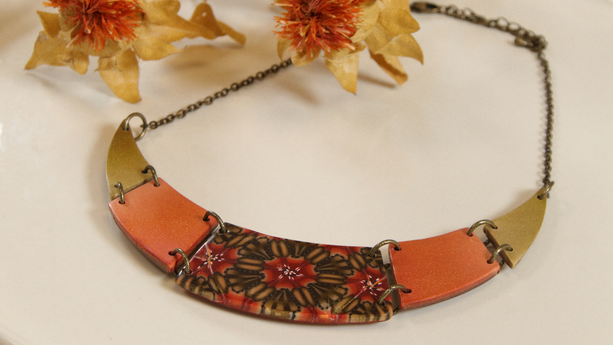 Schema Geometrical breastplate collar and kaleidoscope duck made of polymer clay Schema Geometrical breastplate collar and kaleidoscope duck made of polymer clay