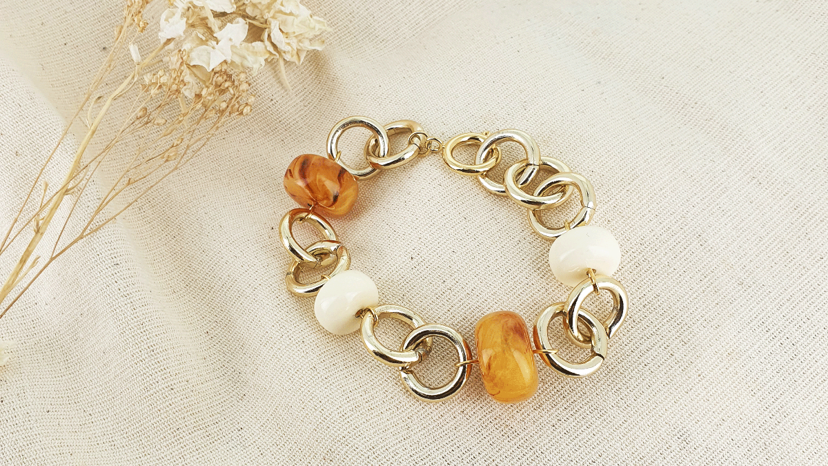 Schema  Gold plated bracelet with round resin beads