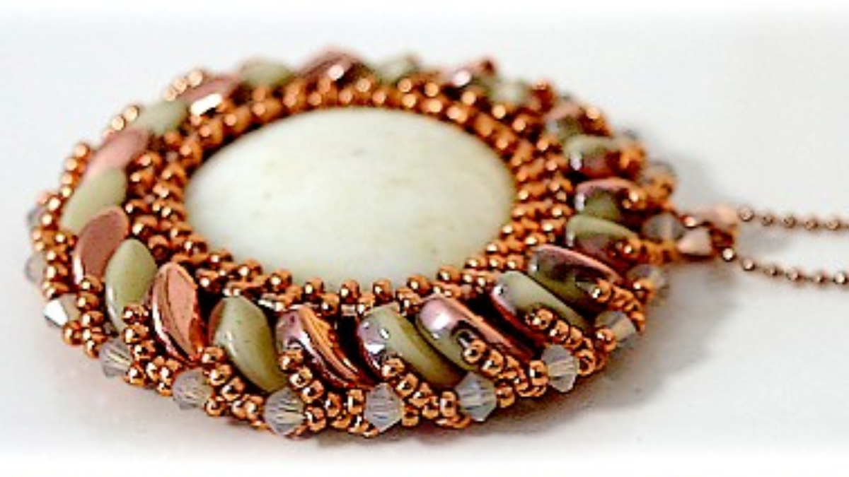 Schema  Sun pendant with Arcos glass beads and cabochon by Puca