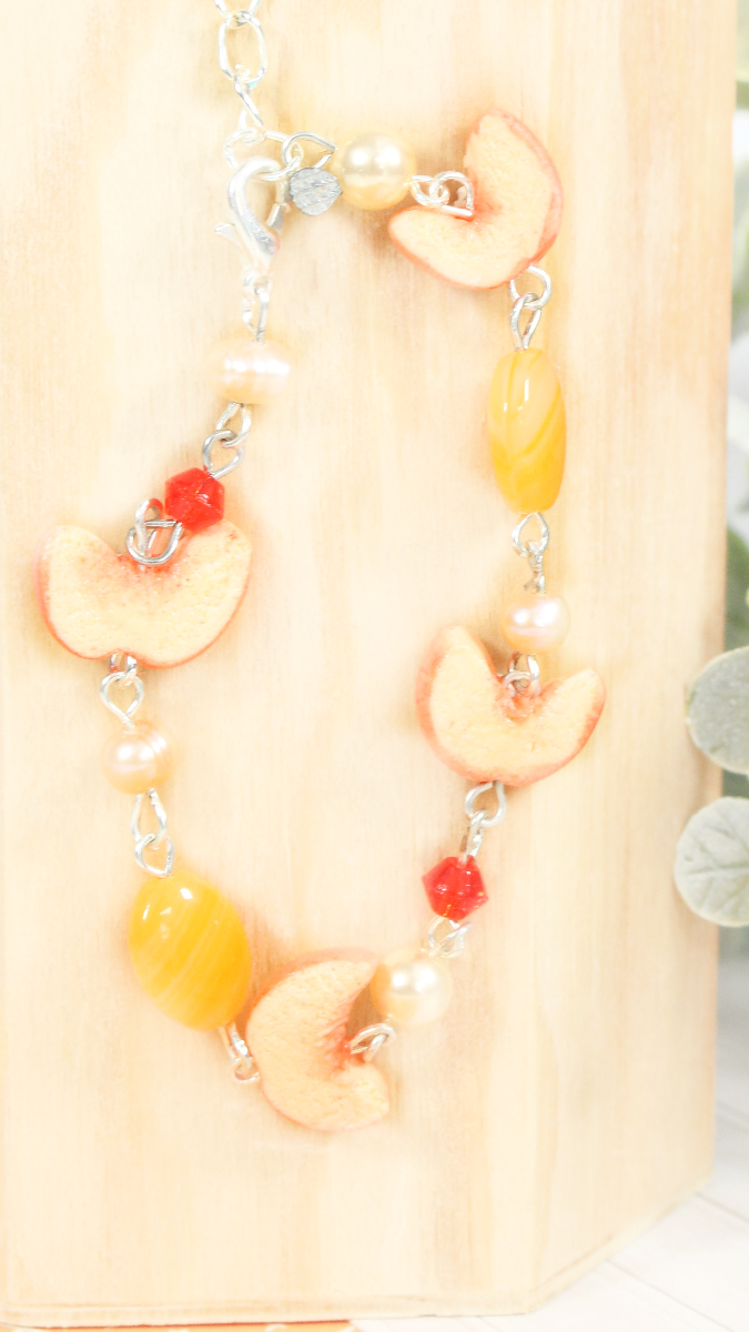 Schema Mixed peach and bead bracelet made of polymer clay Schema Mixed peach and bead bracelet made of polymer clay