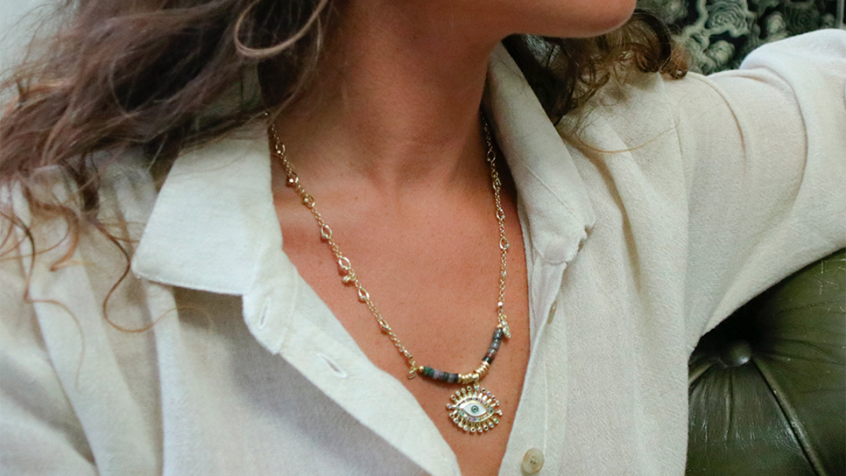 Schema  Fancy necklace with eye pendant and zircons