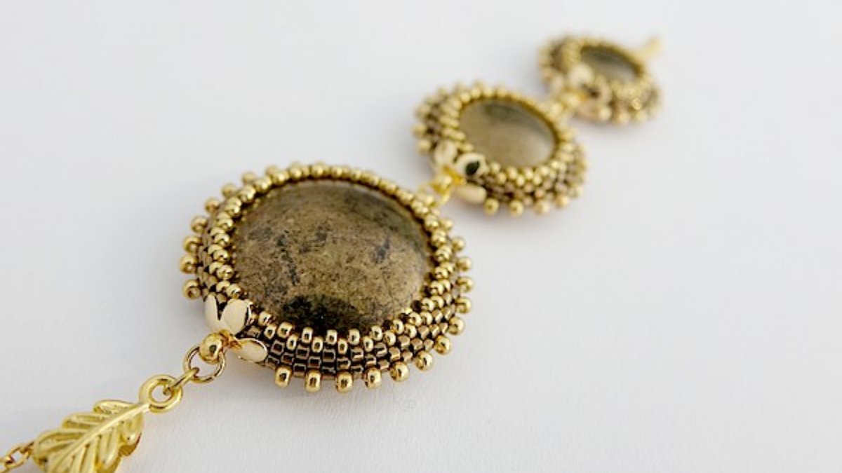 Takamata pendant with cabochons by Puca set with Miyuki beads