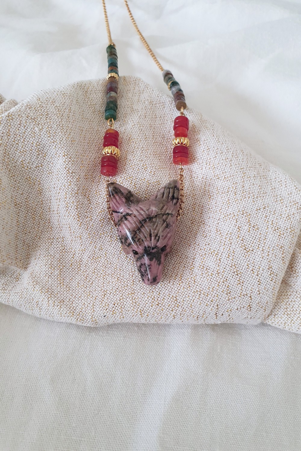 Schema Rhodonite and heishi beads wolf head pendant necklace Schema Rhodonite and heishi beads wolf head pendant necklace