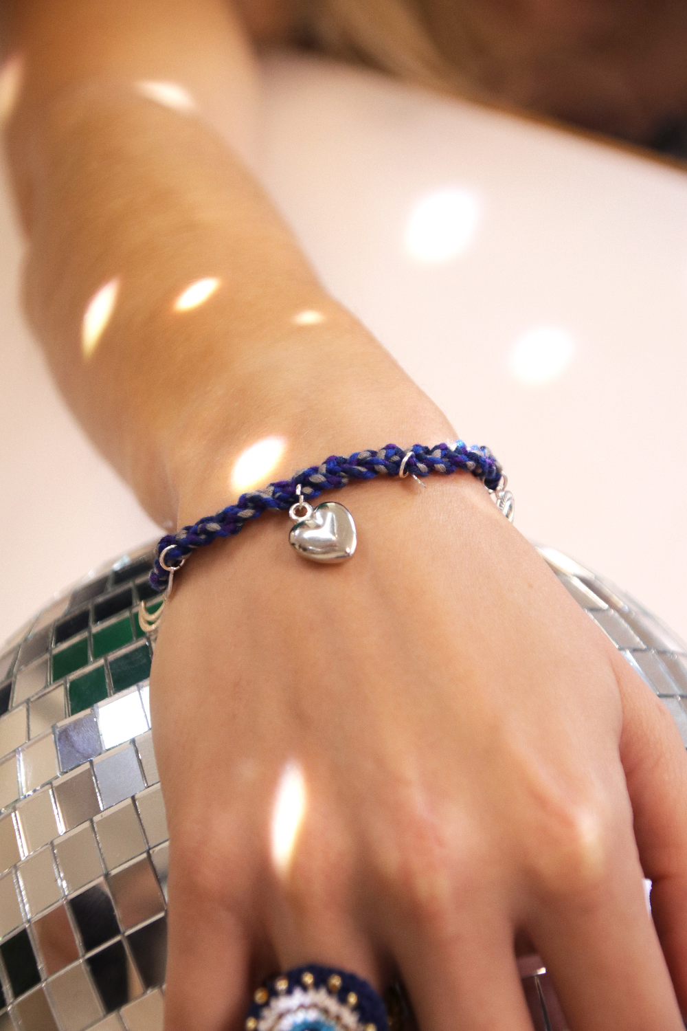 Schema  Silver-plated grigri bracelet with charms and blue braided cotton thread