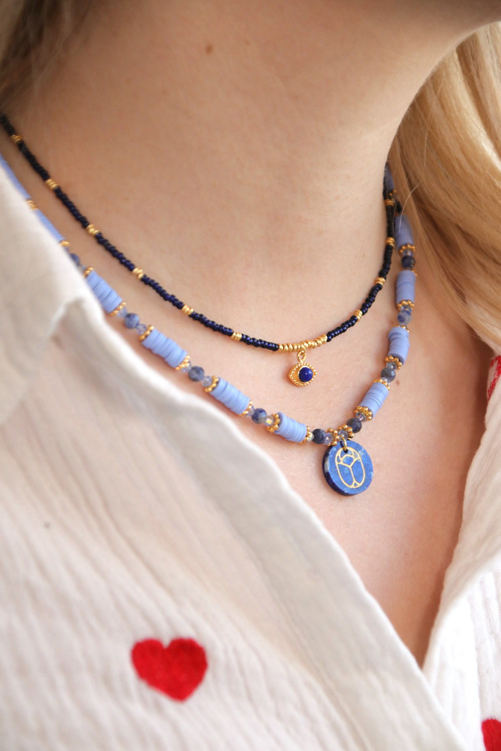 Schema Duo of gemstone gri-gri necklaces with scarab pendant Schema Duo of gemstone gri-gri necklaces with scarab pendant