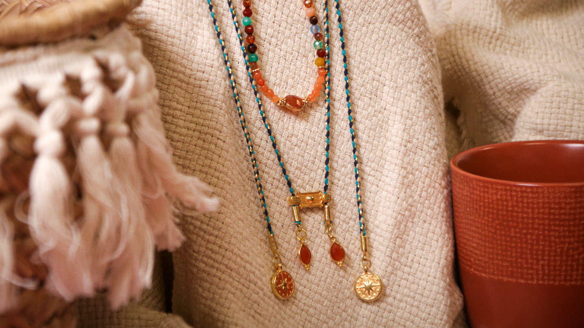 Stacking of bohemian chic necklaces with gemstones and charms