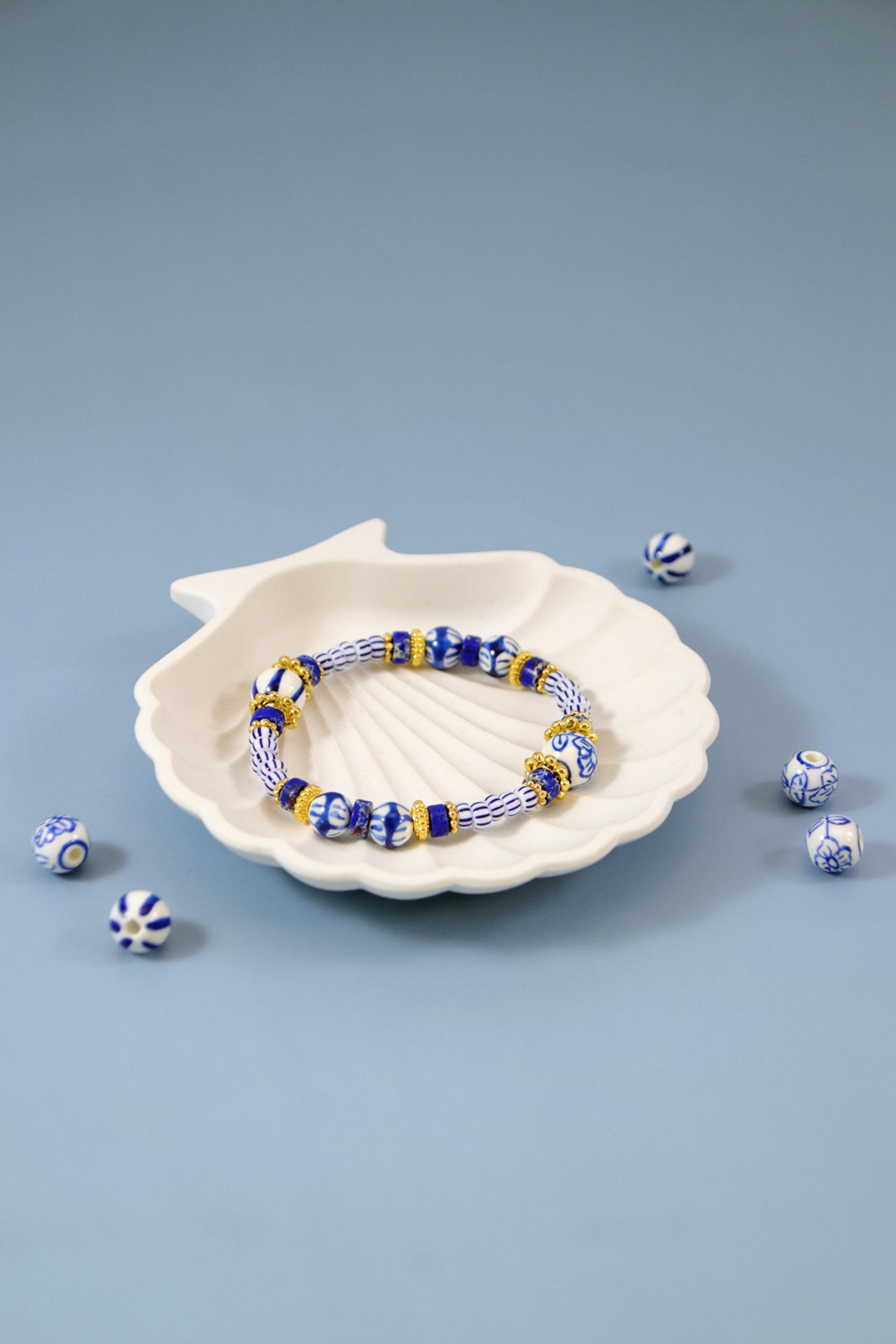 Schema  Elastic bracelet with hand painted blue ceramic beads