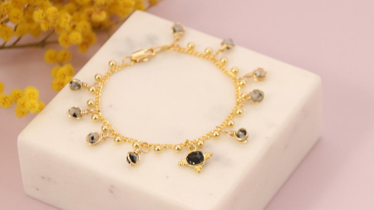 Schema  Gold chain bracelet with beaded charms