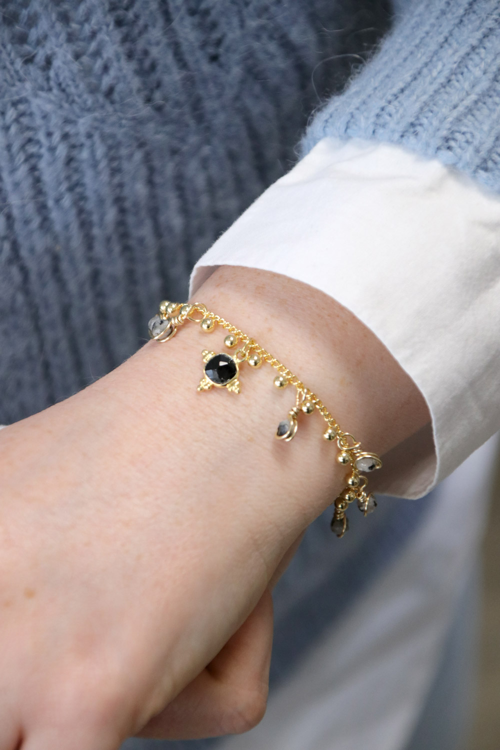 Schema  Gold chain bracelet with beaded charms