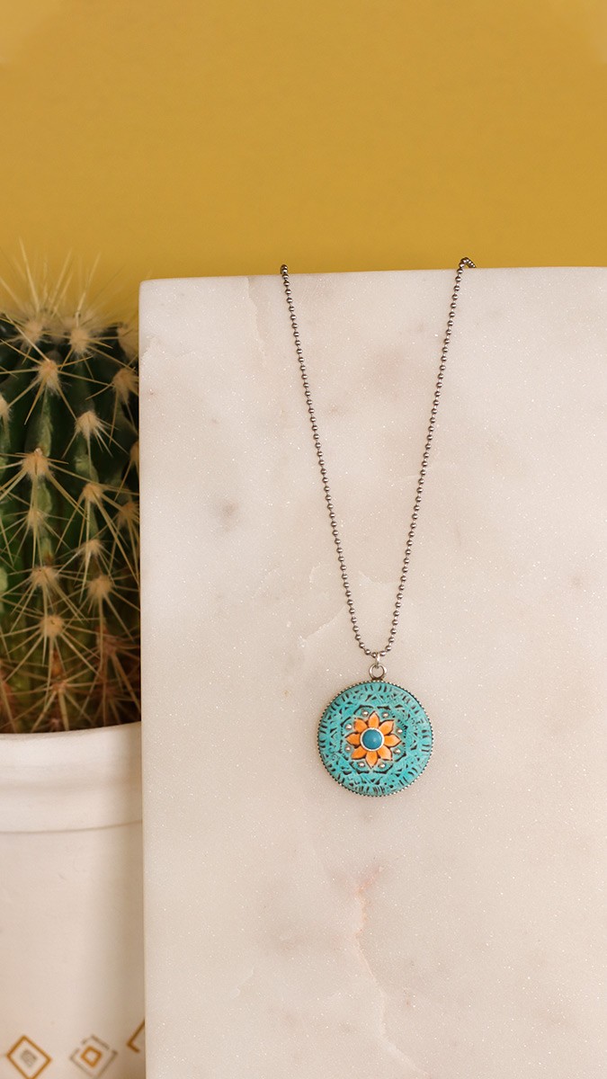 Schema  Polymeric mandala pendant with silver setting