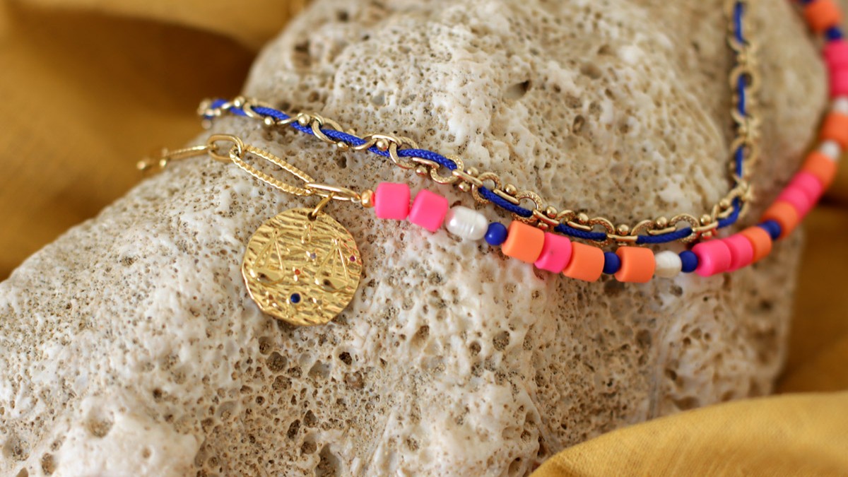 Schema  Multi-strand necklace with large shawl, Heihi beads, freshwater pearls and Libra zodiac charm.