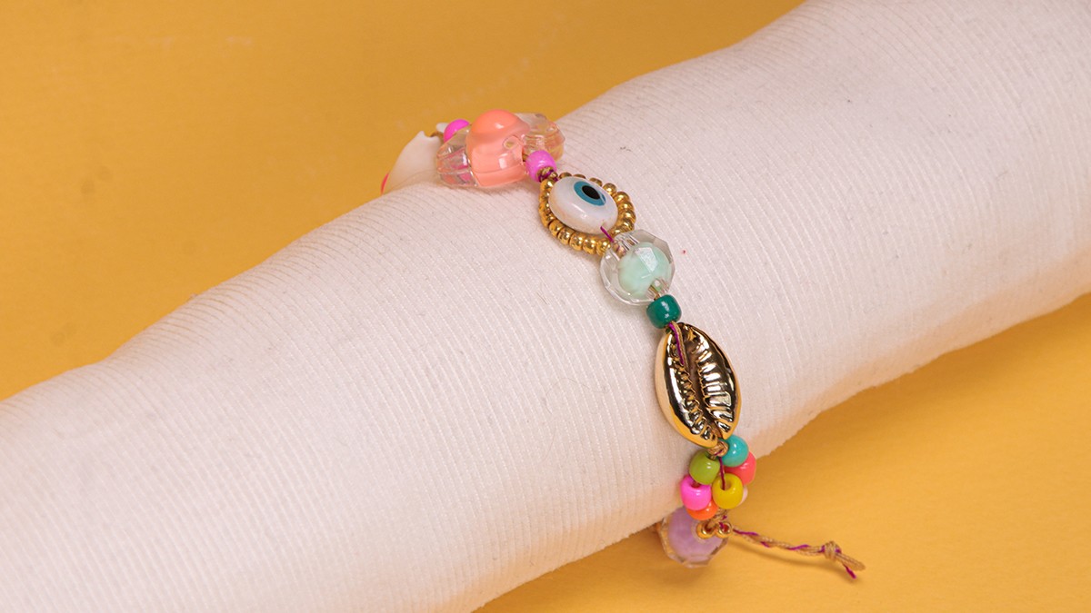 Summer bracelet with cowrie shells, seed beads and eye Summer bracelet with cowrie shells, seed beads and eye