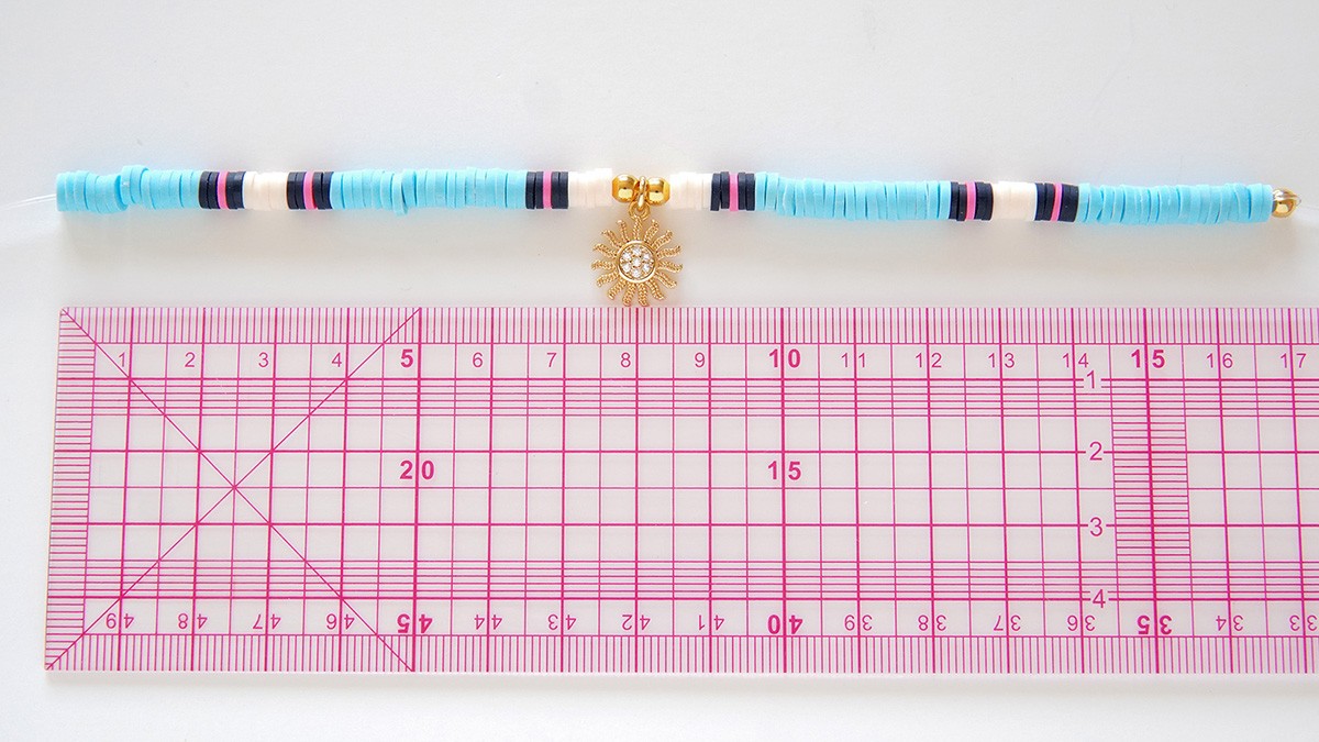 Assortment of bracelets with heishi and gold charms : Step 1