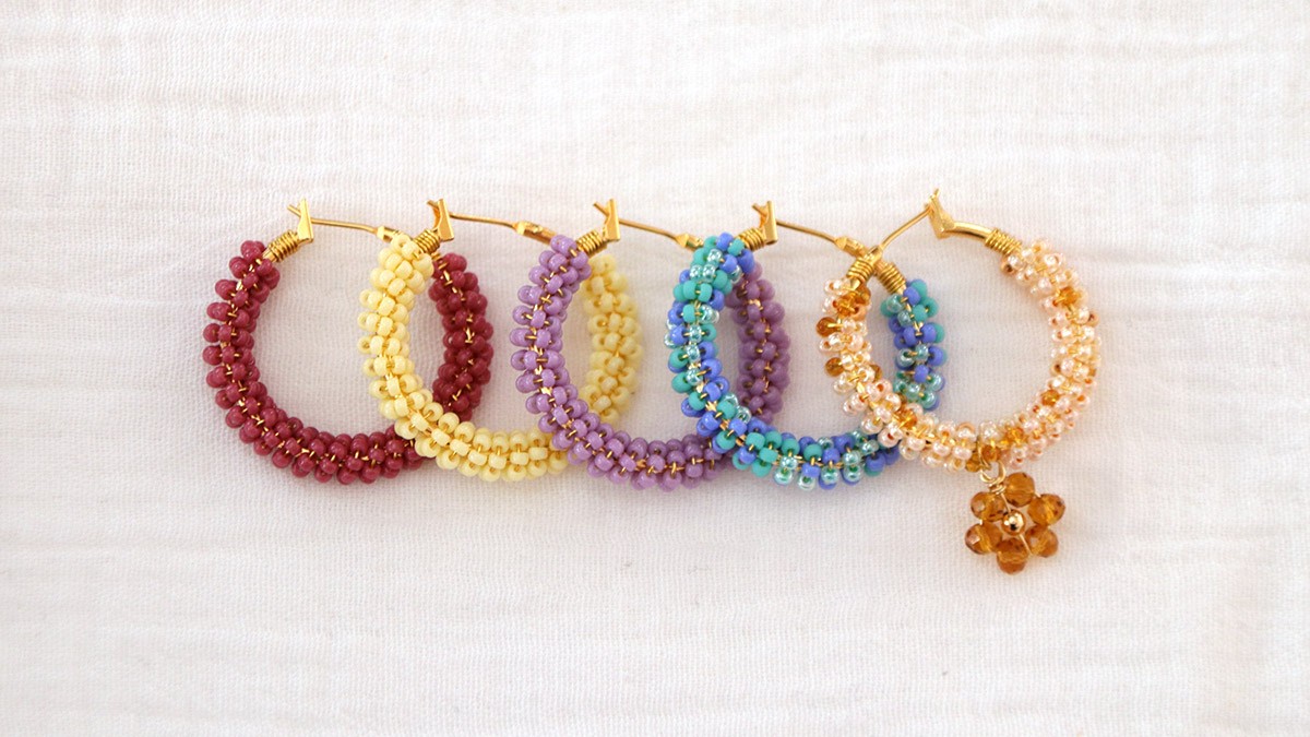 Schema  Colorful creoles with seed beads wrapped around them