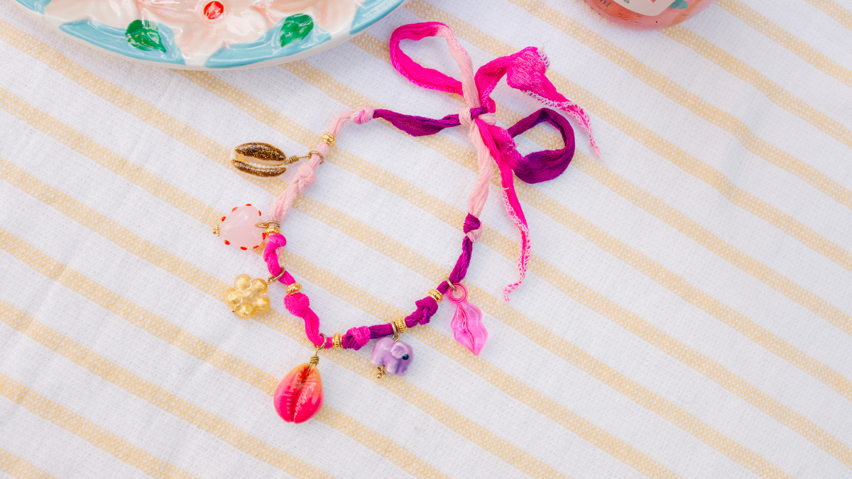 Schema  Anklet with charms and silk ribbon